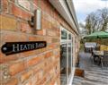 Relax in your Hot Tub with a glass of wine at Heath Barn; Herefordshire
