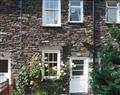 Enjoy a glass of wine at Heron View Cottage; Ambleside; Cumbria