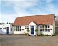 Enjoy a glass of wine at Hill House Cottages - Hill House Cottage; Norfolk