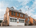 Enjoy a glass of wine at Hilltop Apartment 4; Leicestershire