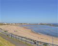 Enjoy a glass of wine at Hogarth Apartment by the Sea; Northumberland