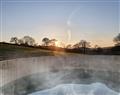 Relax in your Hot Tub with a glass of wine at Honey @ Stars & Embers Glamping; ; Gaerwen