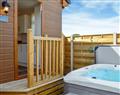 Relax in your Hot Tub with a glass of wine at Ivy Cottage; North Yorkshire