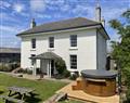 Relax in your Hot Tub with a glass of wine at Lambside House; Plymouth; Devon