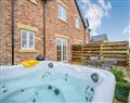 Relax in your Hot Tub with a glass of wine at Lavender & Daisy Cottages - Daisy Cottage; Warwickshire