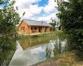 Relax in your Hot Tub with a glass of wine at Lily-pad Lodge; ; Thorpe-on-the-Hill