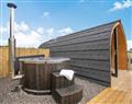 Relax in your Hot Tub with a glass of wine at Llain Pods- Llain Pod 2; Dyfed