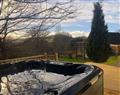 Relax in your Hot Tub with a glass of wine at Llygad-Yr-Haul; Powys