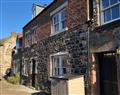 Enjoy a glass of wine at Lower Bamburgh View; Northumberland