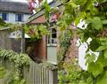 Enjoy a glass of wine at Lower Court Cottages - Om Shanti; Devon