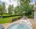 Relax in your Hot Tub with a glass of wine at Luckington Stables 2; Somerset