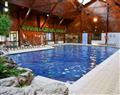 Relax in your Hot Tub with a glass of wine at Macdonald Spey Valley Resort - Aviemore Apartment; Inverness-Shire