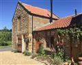 Enjoy a glass of wine at Manor House Dairy Cottage; North Yorkshire