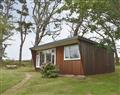 Enjoy a glass of wine at Mount Hawke Holiday Bungalows - Chalet 6; Cornwall