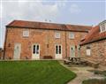 Enjoy a glass of wine at Ned Cottage 1-bed; ; Acaster Malbis