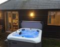 Relax in your Hot Tub with a glass of wine at Old Chalksole Cottages - Horseshoe Cottage; Kent