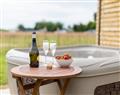 Relax in a Hot Tub at Olive at Buttercup Barn Retreats; ; Wootton Bridge