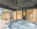 Relax in your Hot Tub with a glass of wine at Owl Lodge; Nottinghamshire