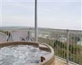 Relax in your Hot Tub with a glass of wine at Pendine Manor Apartments - Dunesend; Dyfed