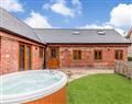 Relax in your Hot Tub with a glass of wine at Pentre Getaways - The Granary; Powys