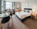 Enjoy a glass of wine at Pier View Apartment 2; Lincolnshire