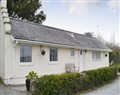 Enjoy a glass of wine at Plas Cottage; ; Llanfaelog