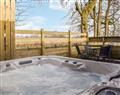 Relax in your Hot Tub with a glass of wine at Poppys Place; Stirlingshire