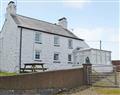 Relax in your Hot Tub with a glass of wine at Porth Colmon Farmhouse; Gwynedd