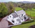 Enjoy a glass of wine at Prospect Cottage; Windermere; Cumbria