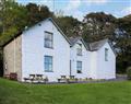 Enjoy a glass of wine at Rhiw Farmhouse; Gwynedd