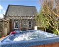 Relax in your Hot Tub with a glass of wine at Rhosson Chapel Cottage; ; St Davids