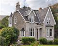 Relax in your Hot Tub with a glass of wine at Rhumhor House; Argyll