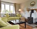 Enjoy a glass of wine at Riverside Cottage; Cumbria