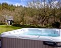 Relax in your Hot Tub with a glass of wine at Rose; Woodland Retreat; Wadebridge