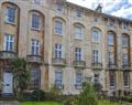 Enjoy a glass of wine at Royal Crescent Apartments - Garden Apartment; Avon