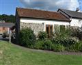 Enjoy a glass of wine at Sid Valley Cottages - The Stables; Devon