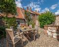 Enjoy a glass of wine at Skeet Cottage; Burnham Market near Kings Lynn; Norfolk