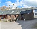 Enjoy a glass of wine at Stone House Farm Holiday Cottages - The Dairy; Cumbria