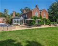 Relax in your Hot Tub with a glass of wine at Sutton Hall; Norfolk