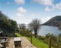 Enjoy a glass of wine at Talland Beach Cottages - Garden Cottage; Cornwall