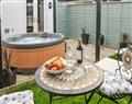 Relax in your Hot Tub with a glass of wine at The Beehive; Norfolk