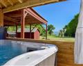 Relax in a Hot Tub at The Coach House; Isle of Wight