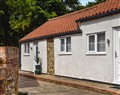 Enjoy a glass of wine at The Ivy Bungalow; Norfolk