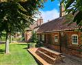 Enjoy a glass of wine at The Long Cottage; Flitcham near Kings Lynn; Norfolk