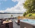 Relax in your Hot Tub with a glass of wine at The Mermaid; ; Brynsiencyn