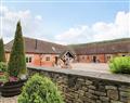 Relax in your Hot Tub with a glass of wine at The Olde Cowshed; Westhope; Church Stretton