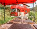 Relax in your Hot Tub with a glass of wine at The Red Bus - Winter retreat; ; Newnham-On-Severn
