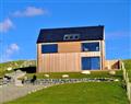 Enjoy a glass of wine at The Sheep Station One; ; Scarista Mhor near Leverburgh
