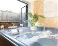 Relax in your Hot Tub with a glass of wine at The Town Houses - Town House II; North Yorkshire
