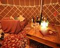 Relax in your Hot Tub with a glass of wine at The Warren Yurt; East Sussex